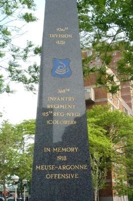 369th Infantry Regiment Memorial - close-up of north face inscriptions and rattlesnake insignia image. Click for full size.