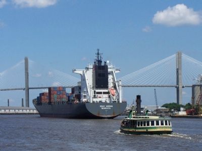 Shipping in the Port of Savannah , Ferry boat works the river along with a container ship image. Click for full size.