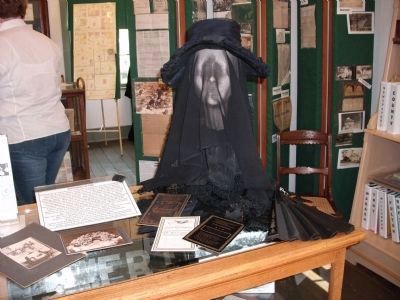 Exhibit of " Mourning Attire " image. Click for full size.