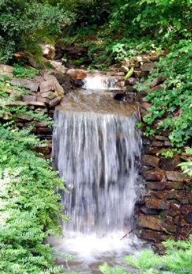 Small Waterfall Emptying into Heritage Pond. Click for full size. Small Waterfall Emptying into Heritage Pond image. Click for full size.