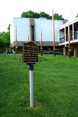 Flood Heights Marker with Poles in Background image. Click for full size.