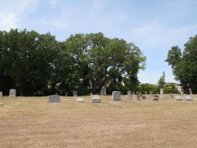 Wider view of the cemetery. Marker by tree center. image. Click for full size.