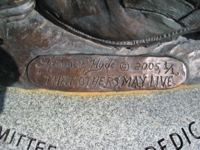 Artist's mark at base of statue image. Click for full size.