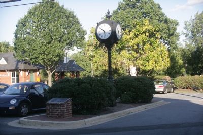 Plaque and clock. The Riverdale MARC station is in the background. image. Click for full size.