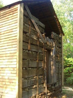 John W. Hall's log cabin, undergoing renovation. image. Click for full size.