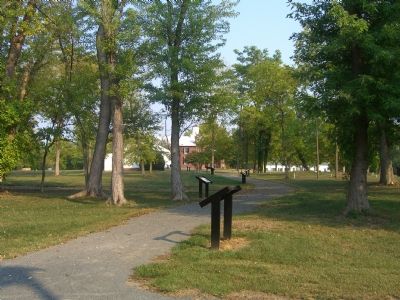 A path full of markers. The 1822 Tavern Site Marker is the second in line.. Click for full size. A path full of markers. The 1822 Tavern Site Marker is the second in line. image. Click for full size.