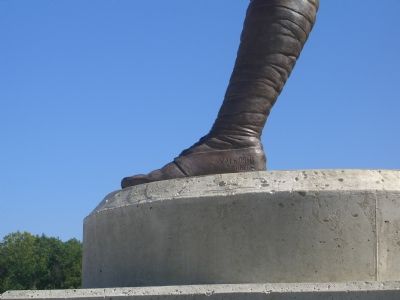 Name on statue's left foot image. Click for full size.