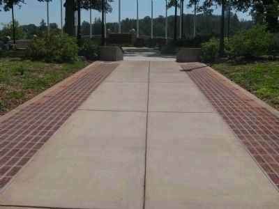 Veteran & Memorial Pavers Line Both Sides of Walkway to Monument image. Click for full size.