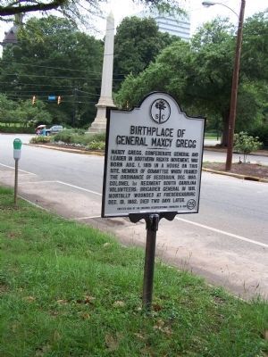 Gregg Marker, seen along Senate St. 1/2 block from State Capitol seen in distant background image. Click for full size.