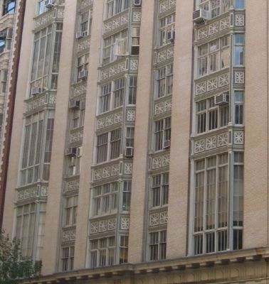 Closeup of Bay Windows Set in Ornamented Cast Iron Frames. Click for full size. Closeup of Bay Windows Set in Ornamented Cast Iron Frames image. Click for full size.
