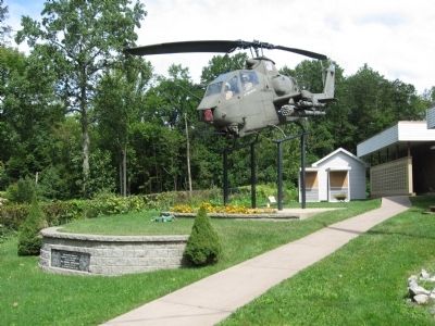 AH1G Huey Cobra Gunship above the stone wall with the marker image. Click for full size.