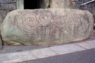 Carved Stone at Entrance to Newgrange Passage Tomb. Click for full size. Carved Stone at Entrance to Newgrange Passage Tomb image. Click for full size.