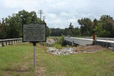 Wadboo Barony Marker, at the Northwest side of Waboo Bridge, looking south image. Click for full size.