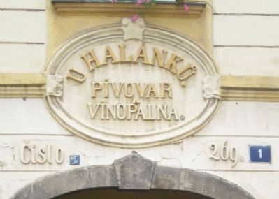 "At the <i>Halenku</i>" brewery and distillery sign above the archway.. Click for full size. "At the <i>Halenku</i>" brewery and distillery sign above the archway. image. Click for full size.