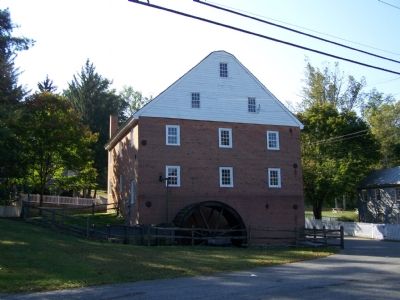 East side of mill with water wheel. image. Click for full size.