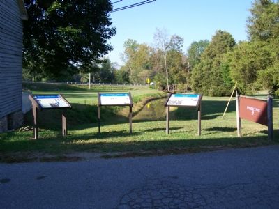 View of three Civil War Markers along Mill Race to Big Pipe Creek. image. Click for full size.