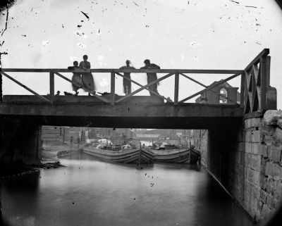 Richmond, Va. Bridge over the Canal; barges beyond.. Click for full size. Richmond, Va. Bridge over the Canal; barges beyond. image. Click for full size.