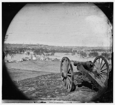 View of city from Belle Isle; gun in foreground. image. Click for full size.