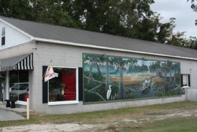 Patriot Departs to Ride with Marion Marker on North wall of Ginger's Flowers , at far right. Click for full size. Patriot Departs to Ride with Marion Marker on North wall of Ginger's Flowers , at far right image. Click for full size.