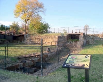 Metal gate at the stone wall image. Click for full size.