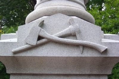 Axe and Mattock on Volunteer Firemen Memorial image. Click for full size.