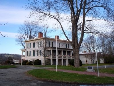 Memorial Marker with Exchange Hotel in background. Click for full size. Memorial Marker with Exchange Hotel in background image. Click for full size.