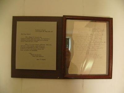 A letter framed and displayed on a wall in the "Death House" image. Click for full size.