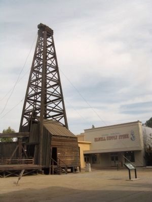 Drilling Rig With George O. Suman Memorial Pioneer Petroleum Exhibit Buildings. Click for full size. Drilling Rig With George O. Suman Memorial Pioneer Petroleum Exhibit Buildings image. Click for full size.