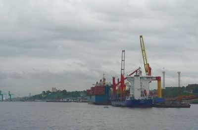 International commerce - containers being transferred between ships in the Port of Manaus. Click for full size. International commerce - containers being transferred between ships in the Port of Manaus image. Click for full size.