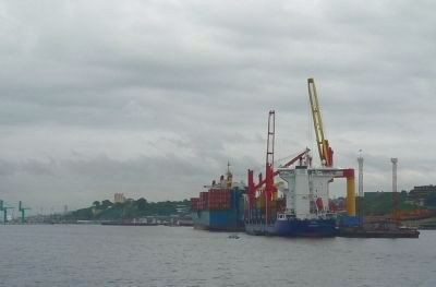 International commerce - containers being transferred between ships in the Port of Manaus image. Click for full size.