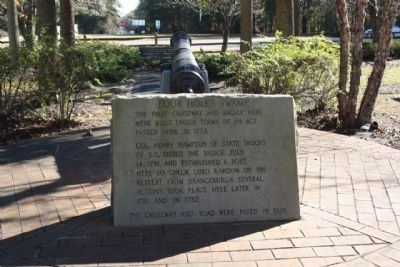 Four Holes Swamp Marker, bridge mentioned, seen in the distance image. Click for full size.