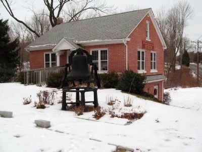 Bell from the Methodist Church in front of the Old Bethlehem Historical Society image. Click for full size.