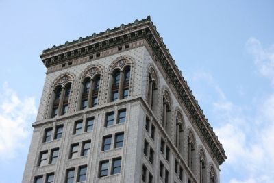 The cornice work with the letter "E" along the top of the Empire Building. image. Click for full size.