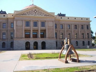 Libert Bell Replica and Arizona State Capitol Building in Background. Click for full size. Libert Bell Replica and Arizona State Capitol Building in Background image. Click for full size.