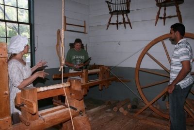 Hands on demonstration of a foot-pumped lathe. Click for full size. Hands on demonstration of a foot-pumped lathe image. Click for full size.