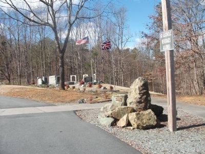 Flags Fly Above the Marker and Stones From the Dam at Clapp's Mill image. Click for full size.