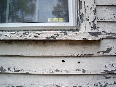 Bullet holes from the battle evident in the Lockett House. image. Click for full size.