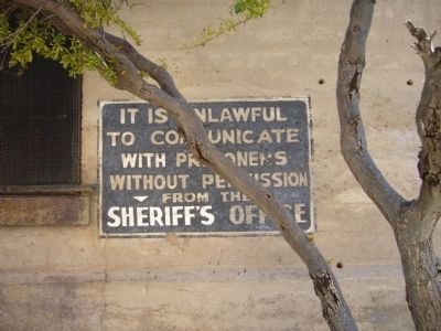 Sign on west wall of Mohave County Jail image. Click for full size.