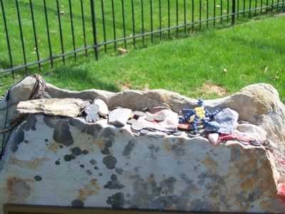 Tokens left on monument. image. Click for full size.