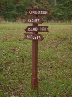 Sign Showing Directions to Four Major Settlements image. Click for full size.