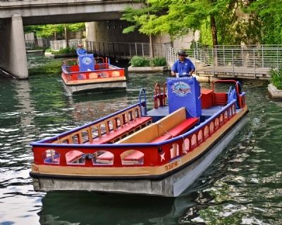 Shallow Barges Ferry Passengers along the San Antonio River image. Click for full size.
