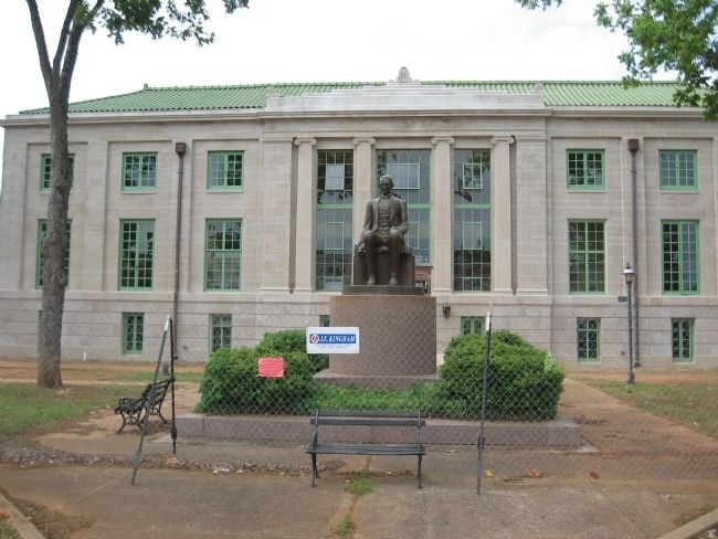 San Augustine County Courthouse and statue of Gov. James Henderson. image. Click for full size.