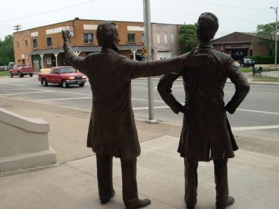 Obverse - - " Let's Debate " Statues image. Click for full size.