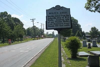 Wolfe's Angel Marker as seen along 6th Ave.(US 64), looking east image. Click for full size.