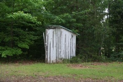 An Old Outhouse Sits Behind the School image. Click for full size.