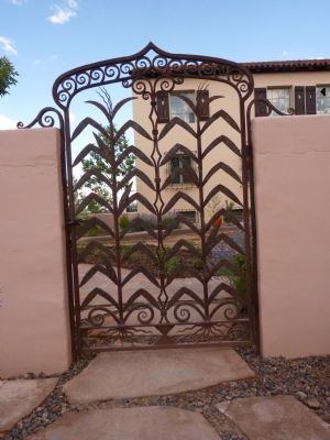 La Posada Entrance Walkway - A modern wrought-iron gate image. Click for full size.