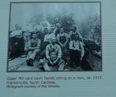 Upper Mill card room hands sitting on a rock, ca. 1915 image. Click for full size.