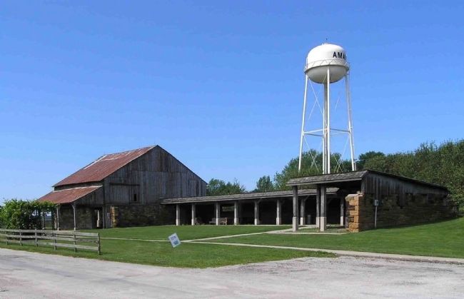 The 19th century Market Barn and the 20th century water tower in the village of Amana image. Click for full size.