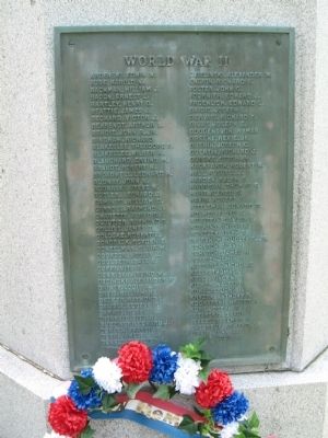 Left Plaque - World War II image. Click for full size.
