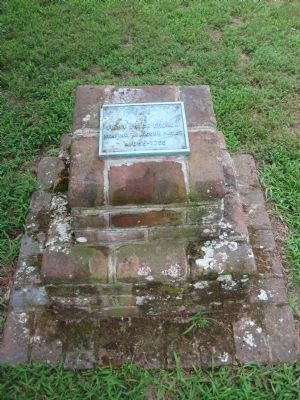 Small brick marker in the church yard image. Click for full size.